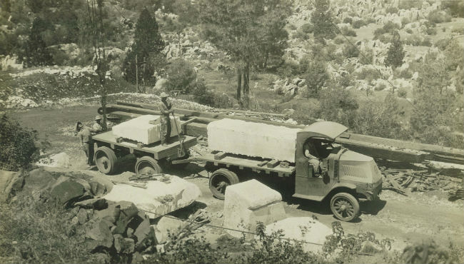 Archive photograph of cut marble blocks being hauled by truck at the Bell Marble Quarry