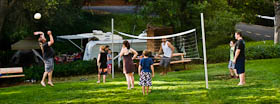 A volleyball game on the sports lawn